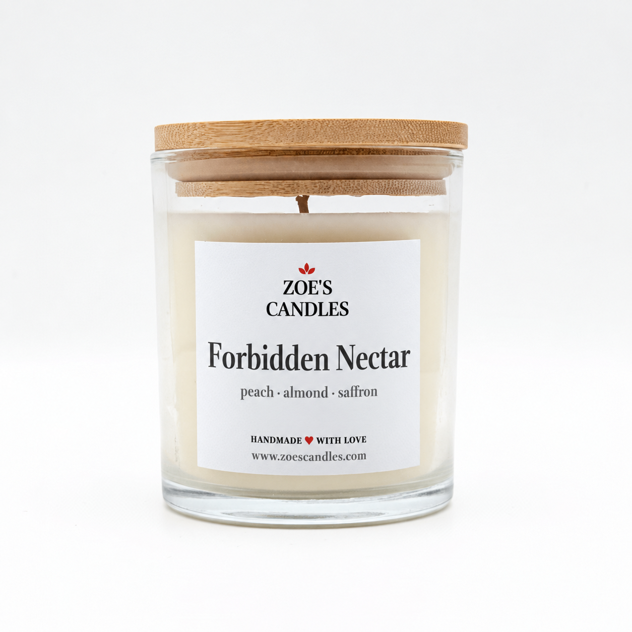 Forbidden Nectar scented candle in a clear glass jar with a bamboo lid