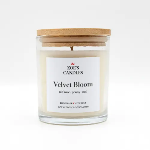 Velvet Bloom scented candle in a clear glass jar with a bamboo lid